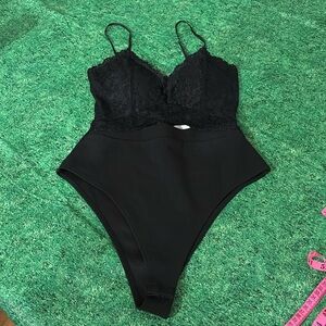 Never worn orange kiss medium bodysuit thong shirt 1495